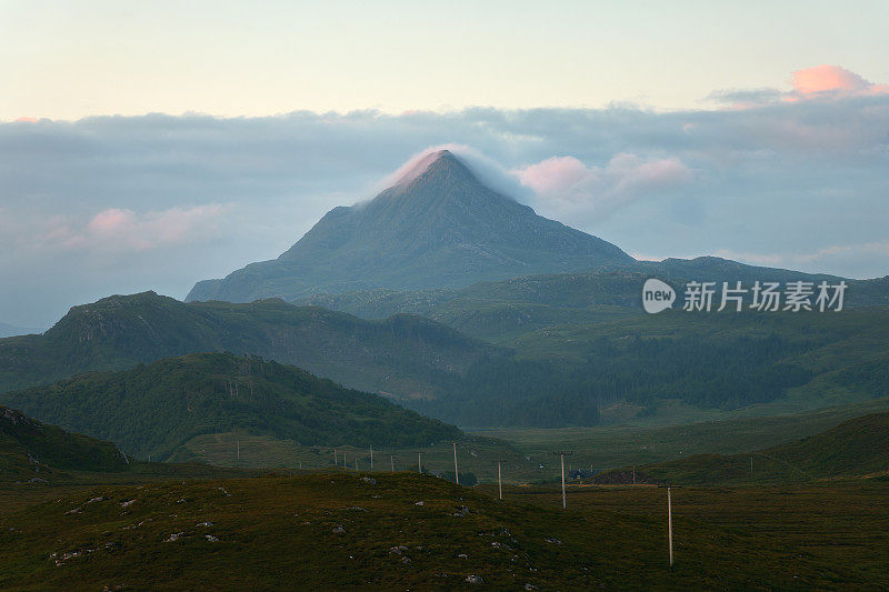 The western slope of Mount Ben Stack and the road through the valley at dawn